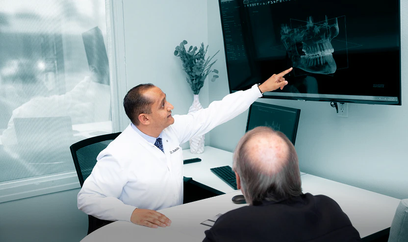 Dr. Amin explains an x-ray to a patient
