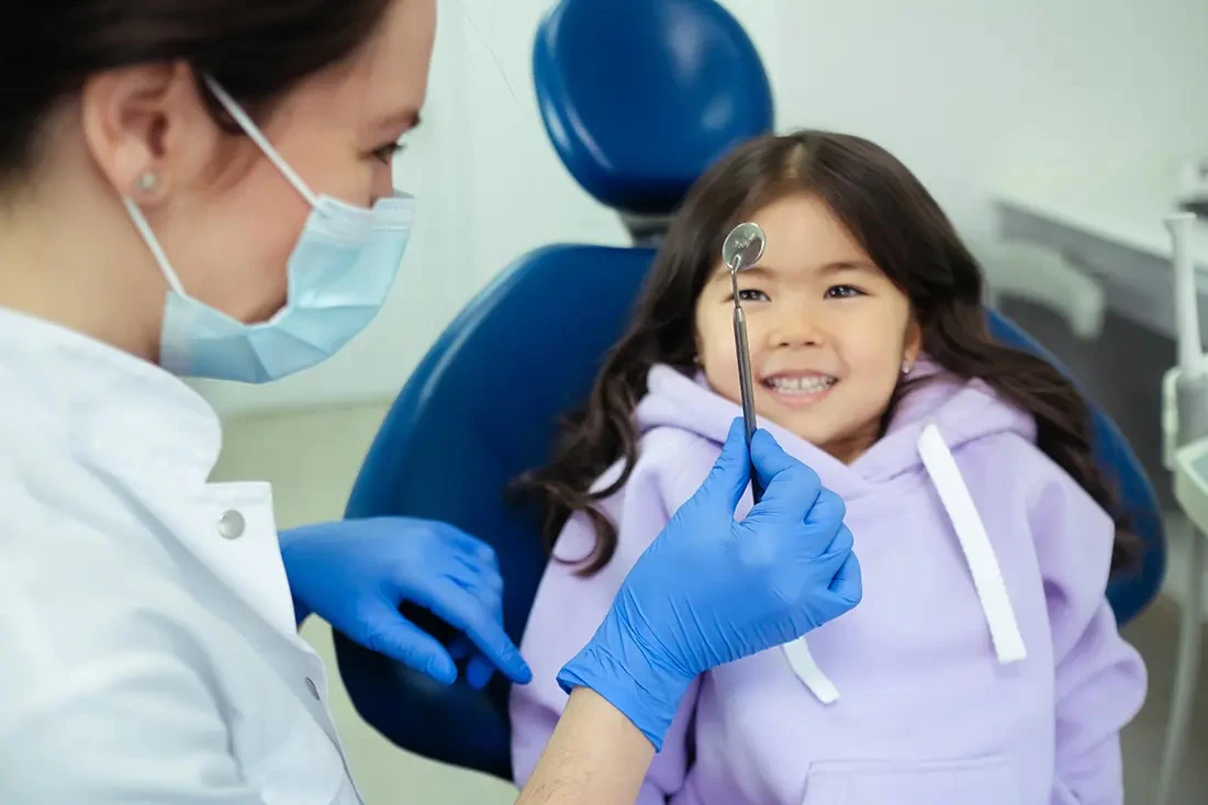 Smiling girl at the dentist