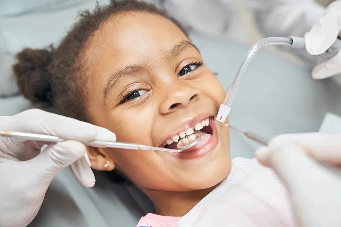 Smiling girl at a dental exam