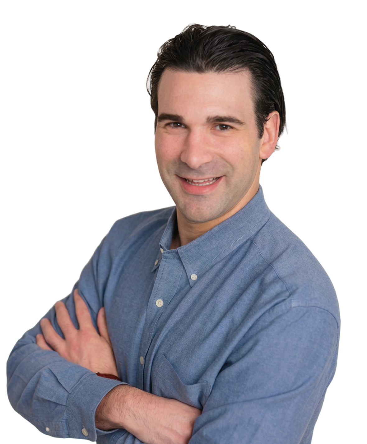 Dr. Kameron Tauber, pediatric dentist at Little Spurs, smiling with his arms crossed