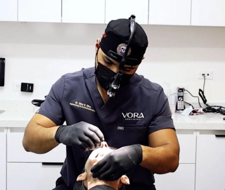 Vora Dentistry dentist with patient