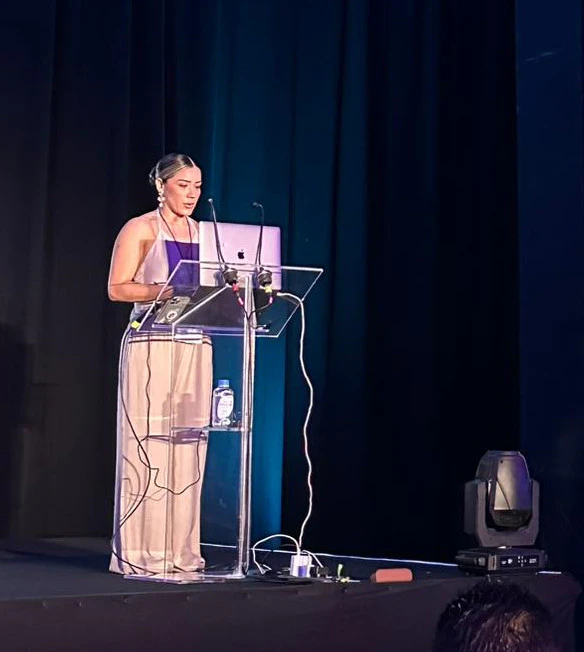Dr. Melony Valdez speaking at a formal event