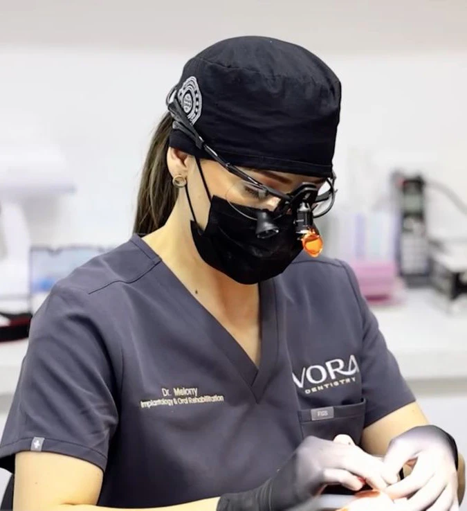 Dr. Melony working on a patient