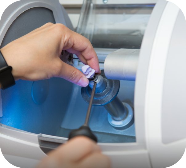 Dentist using a CEREC milling unit