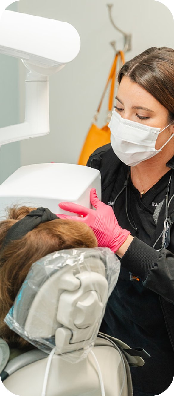Hygienist treating a patient