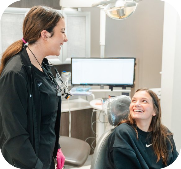 Dental assistant talking with a patient