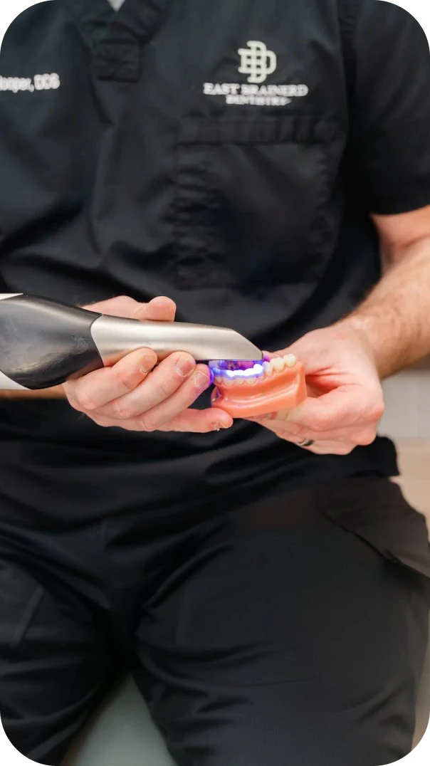 Dentist holding an intraoral scanner